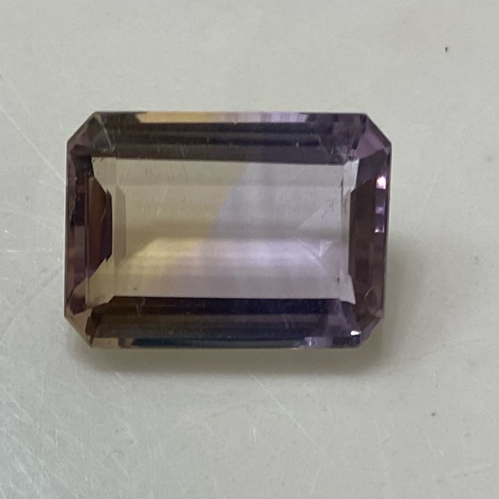 Loose Emerald cut lite Ametrine.   (Part Amethyst and part Citrine).